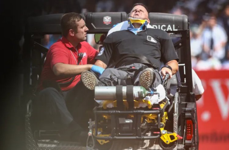 Umpire Nick Mahrley carted off after broken bat hits his neck during Yankees-Rockies game